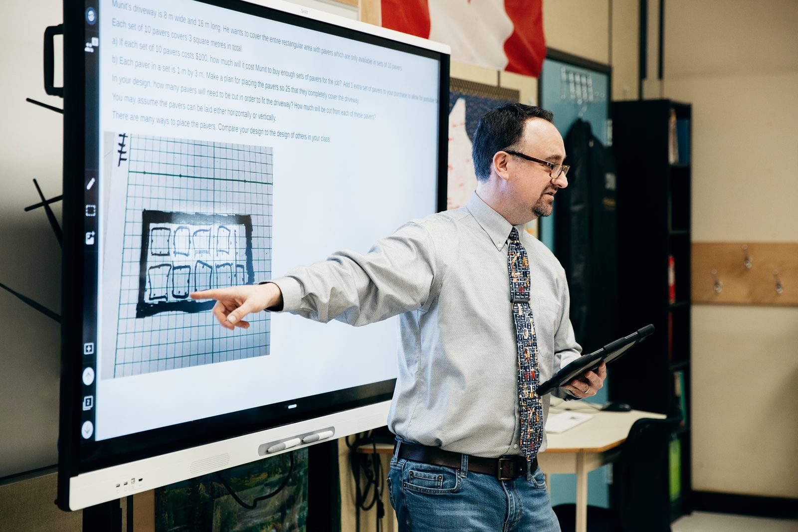 Educator leading a session on an interactive display
